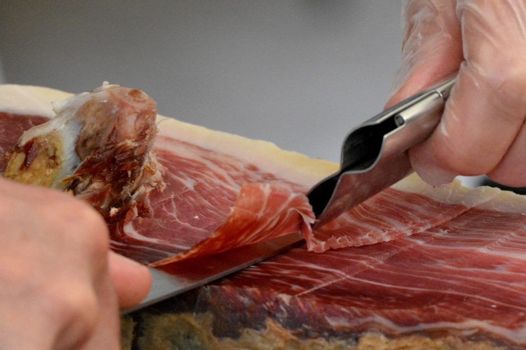 Iberian bellota ham being cut