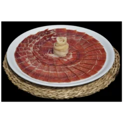 Teruel serrano ham displayed on a plate with a twist of cheese