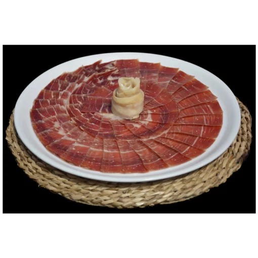 teruel serrano ham displayed on a plate with a twist of cheese