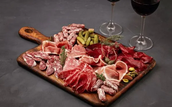 Spanish charcuterie board with iberian hams and other meat products