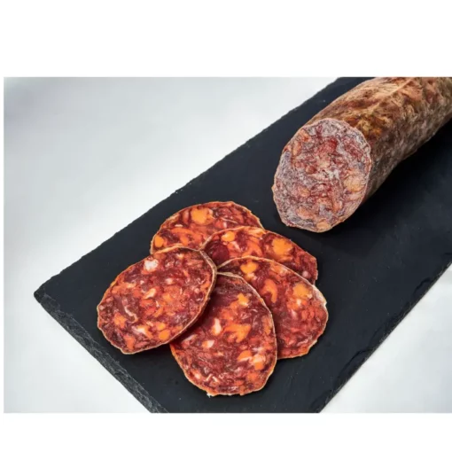 chorizo cular extra partially slices on a slate
