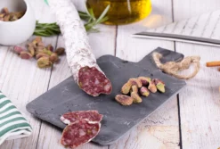 El pozo Catalan sausage fuet partially sliced on a charcuterie board