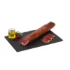 Acorn Fed Iberian Pork Tenderloin sliced and unsliced on a slate with olive oil