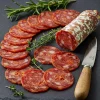 Sliced Iberian Chorizo Extra (400g) 3 Iberian chorizo extra from prado bellow partially sliced on a board