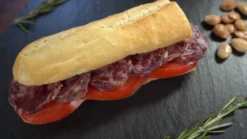 Spanish spicy sausage, salchichon, in a bread roll