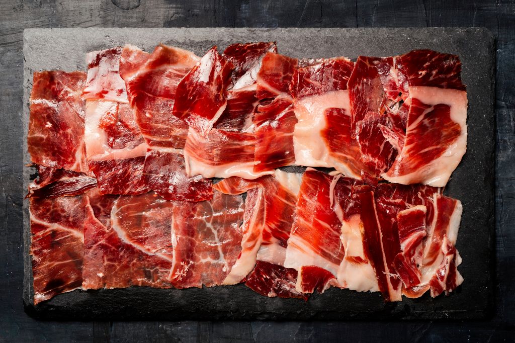 Iberian ham from Spain cut and displayed on a charcuterie board