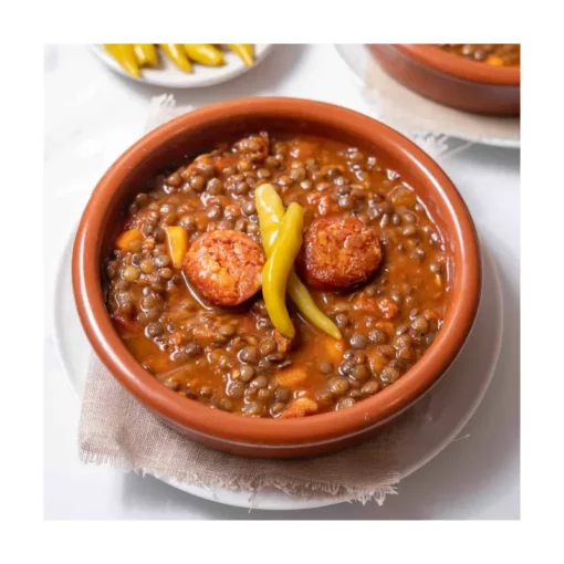 Bowl of cooked spanish lentils dish with chorizo