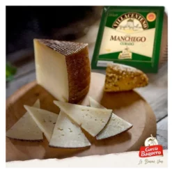 Villacenteno aged manchego cheese wedges on a cheese board