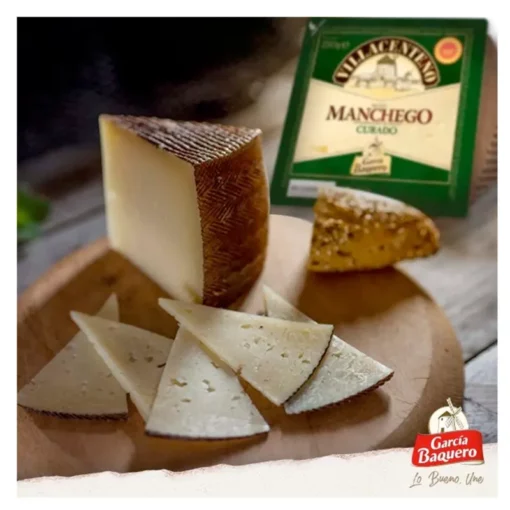 Villacenteno cured manchego cheese wedges on a cheese board