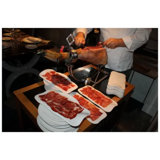 Jamonero carving full iberian ham and serving