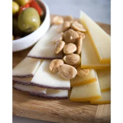 Marcona fried almods displayed with cheeses and olives