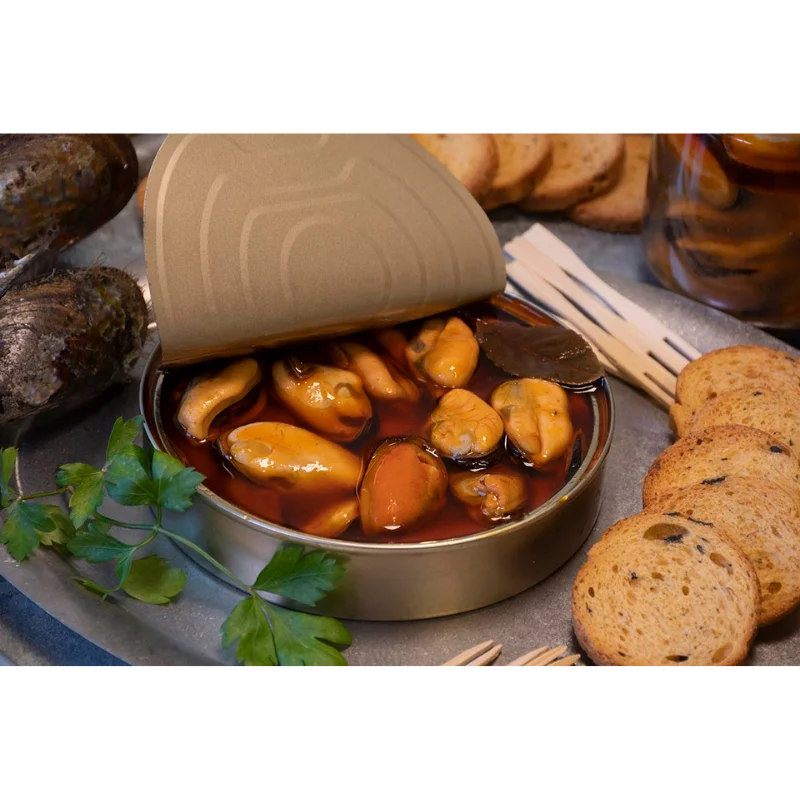 Fried Estuary Mussels in Spicy Marinate (72g) 2 A Conserveira fried estuary mussels in spicy marinate with tin open showing the mussels