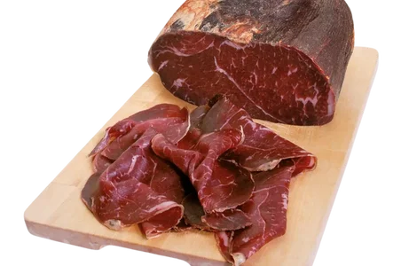 Cecina de Leon partially sliced on board