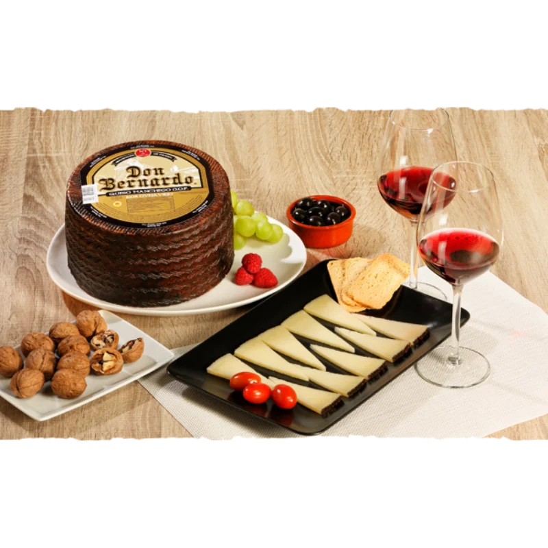 Don Bernardo Manchego Cheese Wheel (3Kg) 3 Don Bernardo Manchego Cheese Wheel presented with slices