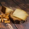 Villacenteno Aged Manchego Cheese Sliced Wedges (110g) 3 Villacenteno Aged Manchego cheese sliced on wooden block