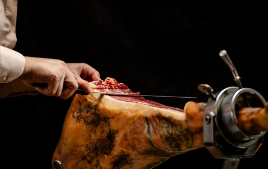 Whole iberian ham being carved - whole iberian ham in ireland